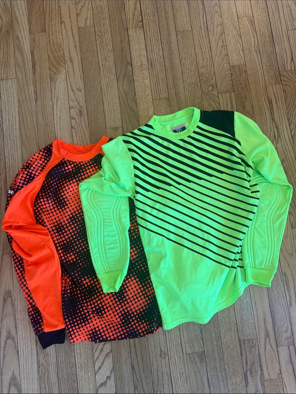 Two soccer goalie/keeper jerseys. Adult small. Lightly padded elbows